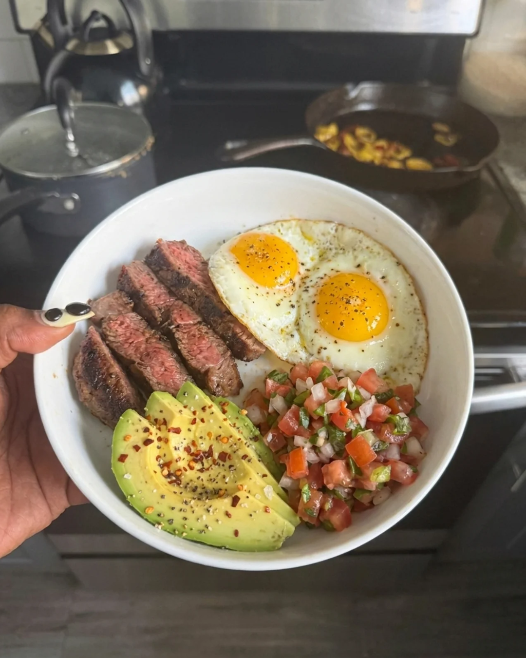 Steak, eggs, avocado and salsa